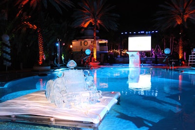 A large ice sculpture of a Maybach Zeppelin sat on a spotlit platform in the pool.
