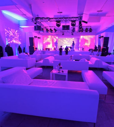 Interlocking LED panels on the stage allowed event producers to create a colorful, textural backdrop. White lounge furniture marked the area for the night's presenters.