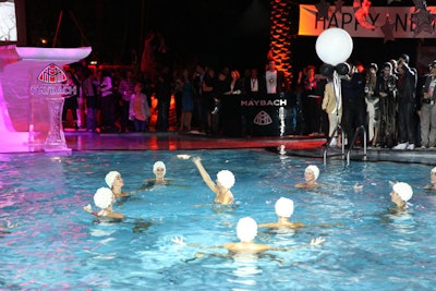 Maybach and David LaChapelle hosted a 1930s-themed party at the Raleigh's pool on Saturday to unveil photos LaChapelle created highlighting two models of the Maybach Zeppelin. During the party, the Dolphinettes of Miami performed two 12-minute routines.