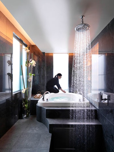 The Mandarin Suite includes private tub and shower area with slate flooring and natural light.
