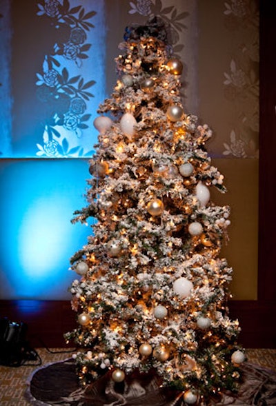 The ballroom's decor theme was modern winter, executed with several snowy trees and metallic ornaments