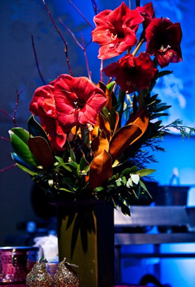 Floral arrangements from Winston Flowers brought splashes or warm color to the predominantly white, blue, and metallic aesthetic in the ballroom.