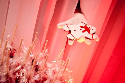 A gloved hand reached out from behind the wall in the enchanted forest to offer sweets like gingerbread men to guests.