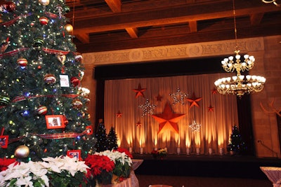 Reminiscent of old barn motifs and in rustic hues, stars hung on the stage curtain.