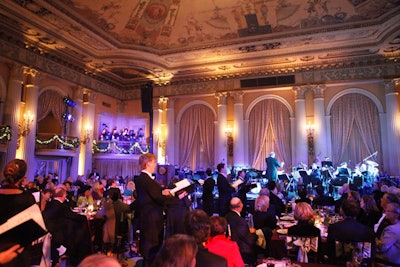 Carolers in the balcony and interspersed among the tables serenaded guests throughout the evening.