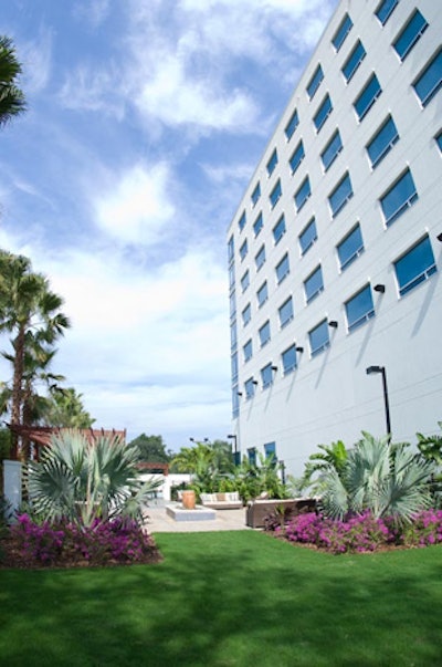 The landscaped lawn adjacent to the pool area can be used for events.