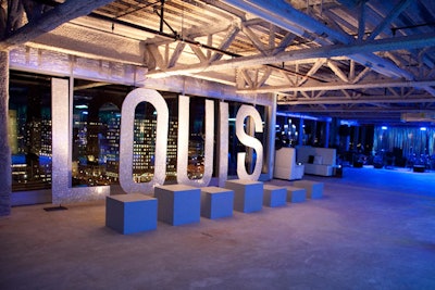 Upscale clothing and home goods store Louis Boston is set to open next year on Fan Pier and was a sponsor of the party. Glittery silver letters spelling out 'Louis' were the backdrop to Lucite cubes where models posed in the store's clothing.