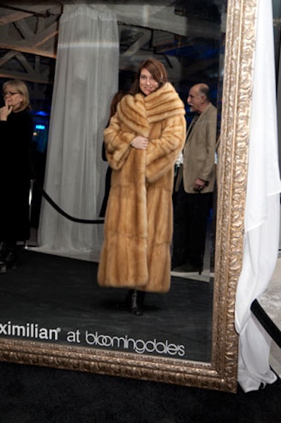 Models showed off furs by Maximilian at Bloomingdale's atop black Lucite cubes. Guests also had the chance to try on coats.