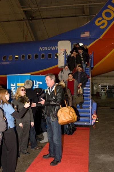 As they landed at Midway, actors were greeted with a red carpet, glasses of champagne, and 'Welcome Home Alumni' signage.