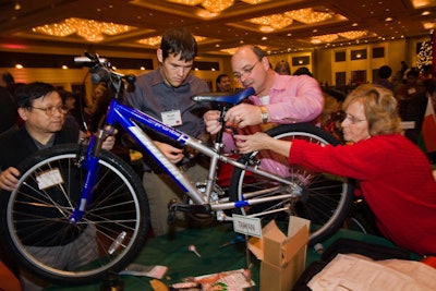 After lunch, some 650 employees divided into teams to build bikes for children associated with Chicago Youth Centers.