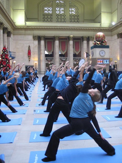 Some 125 participants took part in the Chicago yoga class (pictured); New York's event drew approximately 100.