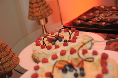 One of the dessert tables held key lime pies topped with raspberries, strawberries, and blueberries.