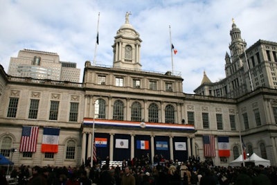 Before arriving at City Hall, the mayor and other officials began the day with volunteer activities throughout the city.