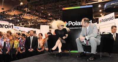 Polaroid brought Lady Gaga—who was recently named creative director for a specialty line of its products—for an appearance. Additional in-booth activities include an exhibition of fine art photography from the Polaroid Collection and live celebrity portrait sessions by photographer Maurizio Galimberti.