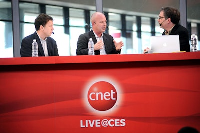 CNET broadcasted from the convention center's upstairs south hall while its editors worked in an adjacent room. A custom truss surrounded the curved main stage. CBS Interactive senior manager of industry marketing Erin Gaffaney oversaw the exhibit, and the Freddie Georges Production Group produced and designed it.