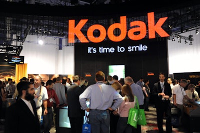 Kodak's Rochester, New York-based trade show manager, Lola Ignatowski, oversaw the brand's 100- by 110-foot exhibit, produced by Rochester-based Mirror Show Management. A giant funnel-shaped screen added drama overhead, showing rotating brand colors and imagery. Programming from the 'K-Zone Stage' streamed live on the Web.
