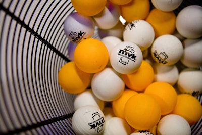 Although no decor was added to the venue, Most Valuable Kids brought in Ping-Pong balls, wrist bands, and head bands emblazoned with its logo.