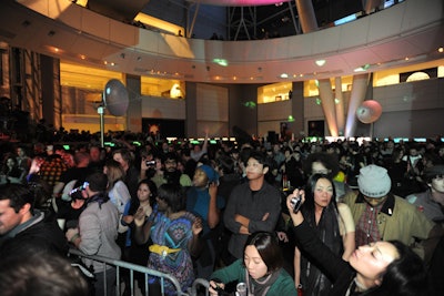 The crowd of 1,500 gathered on the makeshift dance floor under the looming Hayden Planetarium.