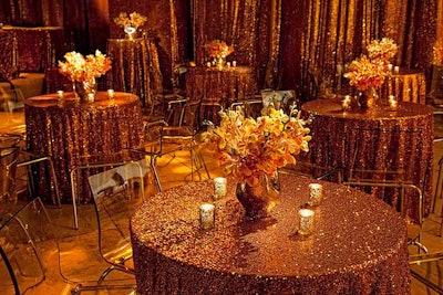 Metallic paillette cloths and mokara orchids topped tables.