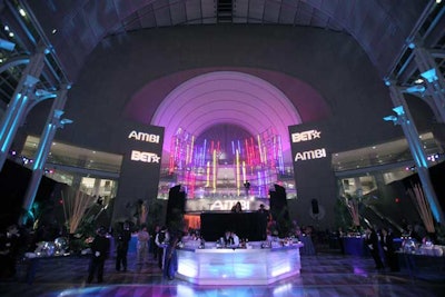 DJ Beverly Bond and DJ D-Nice played their sets at the after-party from a 10-foot raised platform hovering over the center of the main bar.