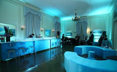 A jazz band played during the cocktail hour before the honoree's dinner, in a room decorated with a long uplit teal bar, teal Ultrasuede couches, and BET logo-emblazoned bar stools.