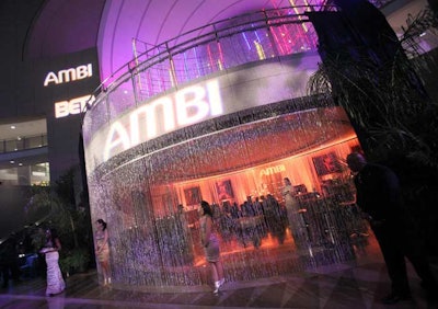 Models holding trays with Ambi skincare products drew aside the crystal string curtains so guests could enter the Ambi lounge at the after-party.