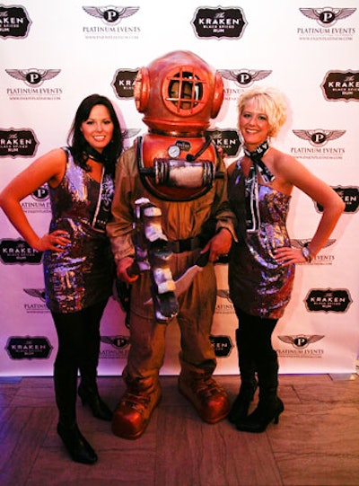 Just beyond the entrance, guests posed with a costumed deep-sea diver in front of a branded step-and-repeat.