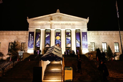 Guests entered the Shedd Aquarium through a marquee, which helped keep them dry on the rainy night.