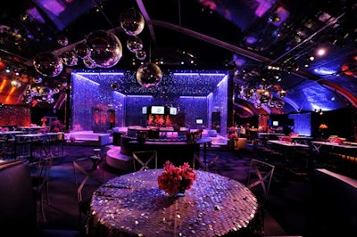 Metallic paillettes topped tables and disco balls hung overhead.