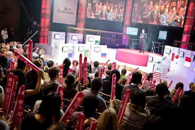 Designed so that the heads of the contestants and M.C.s wouldn't block the screens, the semicircular stage was divided into two tiers with a round podium in the center.