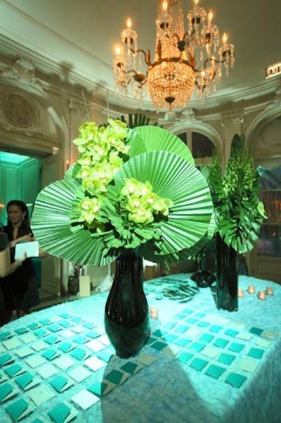 Seating cards for the honoree dinner were accented by frond-filled arrangements