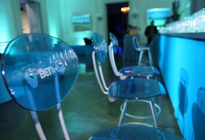 BET-branded acrylic stools lined up at the bar at the honoree dinner.