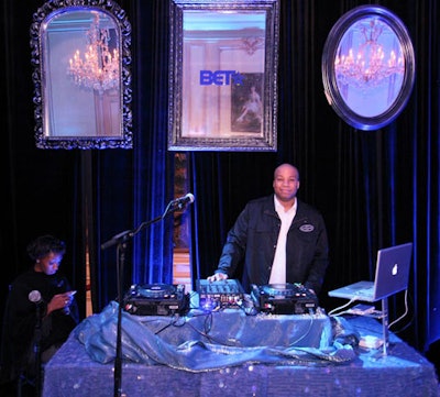 DJ Sixth Sense performed inside the Meridian House during the honoree dinner, where he was flanked by gilded (and branded) mirrors.