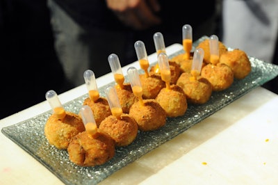 Domenic Chiaromonte of Match Restaurant served risotto balls at a catering station on the show floor.