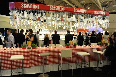 Event producer Marion Heintzman of Heintzman Productions displayed items like cheese graters, strainers, and dishes from a massive kitchen rack above the main bar, sponsored by Scavolini.