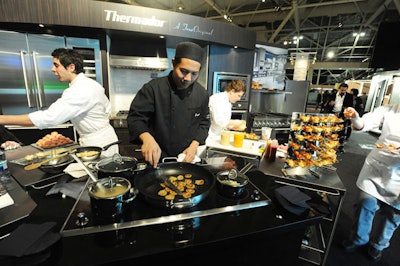 More than 22 catering stations and bars dotted the show floor for the opening night party.