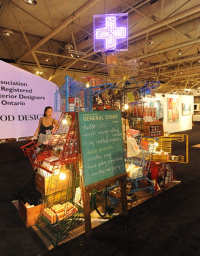 The Drake General Store used a stack of colourful shopping carts to display items like maple syrup cotton candy at a pop-up shop on the show floor.