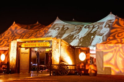 In October, Kinetic Lighting worked with Poko Event Productions to give the Gene Autry Museum of Western Heritage's annual gala an appropriately country vibe. Kinetic used a video projector to illuminate the outside of the tented dining room with high-resolution image of women riding horses. Gobos projected patterns on either side of the photograph.