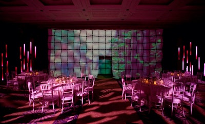 For a Van Cleef & Arpels dinner in November 2008, Glow Design Group worked with David Beahm Design to create an elegant setting lit in a rotating palette of jewel tones. Glow also projected video onto a backdrop by Atomic Design and installed Versa Tubes, which added a neonlike effect and played additional video.