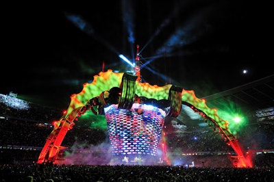 Show director and designer Willie Williams worked with production architect and designer Mark Fisher and production director Jake Berry to create one of the largest concert touring structures for U2's 360° tour. At the center of the stage was an expandable, movable 360-degree LED video screen made of elongated hexagonal segments. PRG provided the lighting, including its Bad Boy automated lights, which throw beams of light 100 feet or more.
