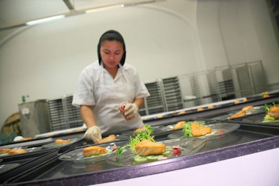 Occasions Caterers' first course was a filet of smoked salmon crusted with pink peppercorns and served with salt-cured cucumber slices and dill and lemon crème fraîche.