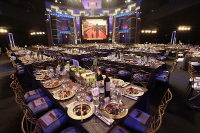 Set designer Joe Stewart created a glittery bronze-and-gold backdrop.