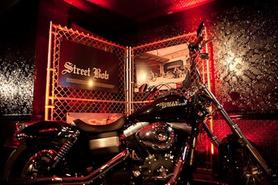 Harley-Davidson showcased bikes from the Dark Custom line in front of retro photographs mounted to chain-link fences throughout the Ace Hotel's Liberty Hall.
