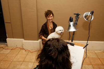 Caricaturists drew sketches of guests and their dogs on the terrace during the cocktail reception.