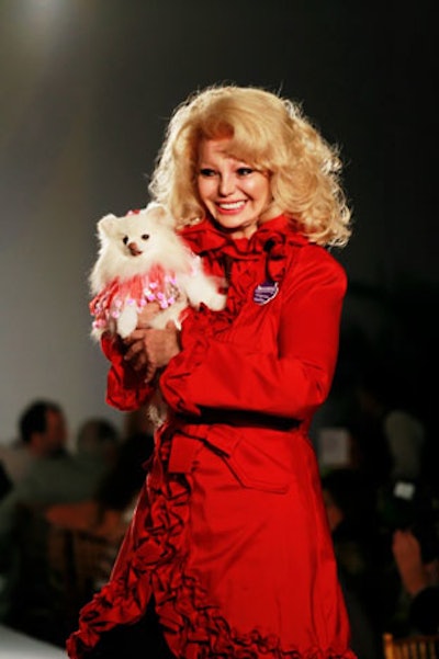 Local philanthropist Lady Beatrice Clancy walked the runway during the dog parade with Pomeranian Candy.