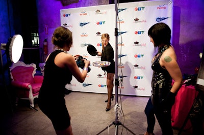 Attendees could pose for photos with a variety of fetish-themed props, including feather boas, leather masks, whips, and hats.