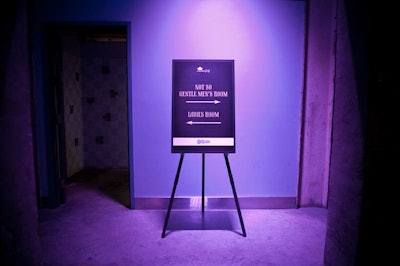 Signage pointed guests toward the restrooms.