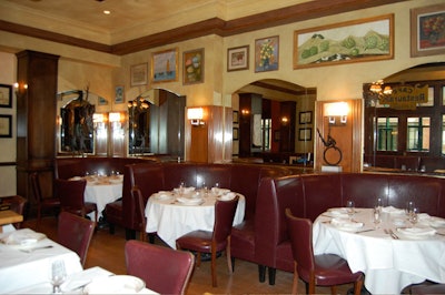 Booths for six run along the inside wall of Bond's main dining room.