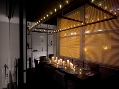 The glass-enclosed private dining room seats 16.