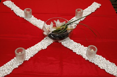 Smooth white pebbles and bamboo-adorned centerpieces topped the low tables.